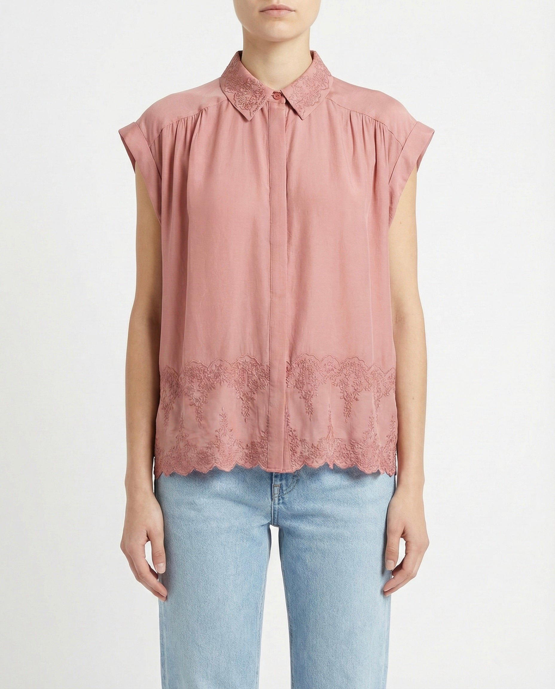 Blusa smanicato con ricamo floreale