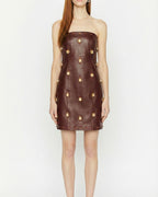 Abito corto in pelle con applicazioni gioiello