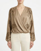 Blusa incrociata ricamata