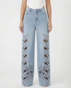 Jeans palazzo con ricami floreali