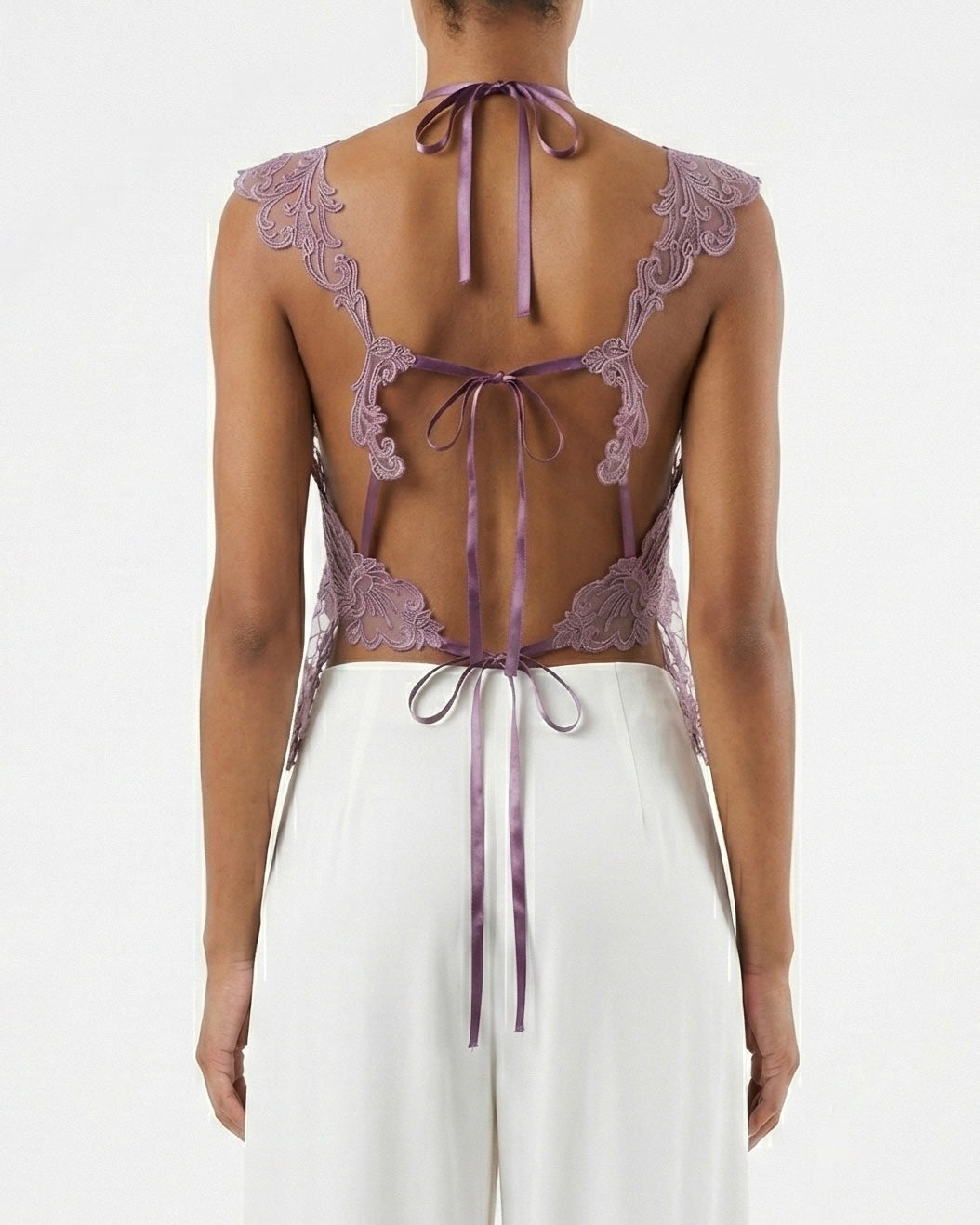 Top in pizzo ricamato con trasparenze floreali