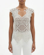Top in pizzo ricamato e chiusura a fiocco