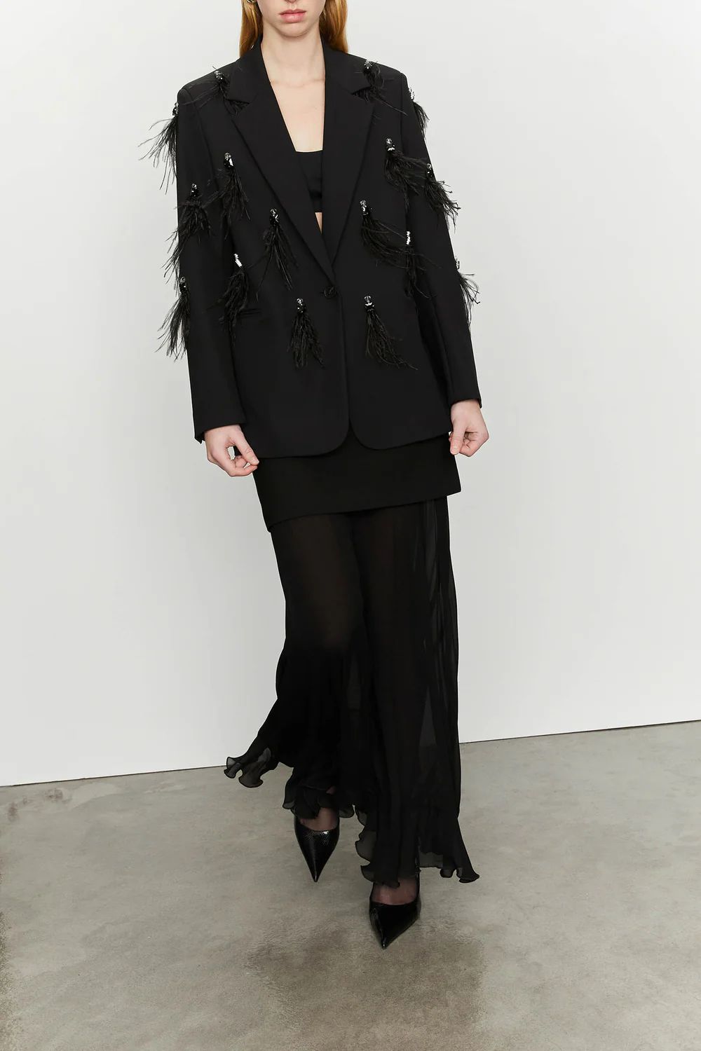 Blazer con piume decorative