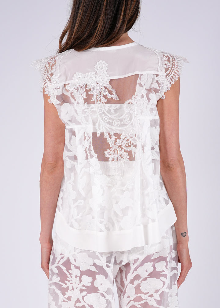 Top in pizzo ricamato con trasparenze floreali