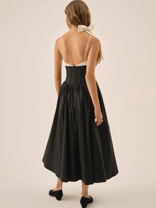 Abito midi bianco e nero con maxi fiocco