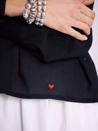 Blusa ascollo a V e maniche a sbuffo