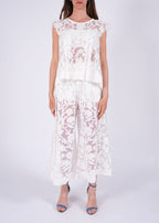 Top in pizzo ricamato con trasparenze floreali