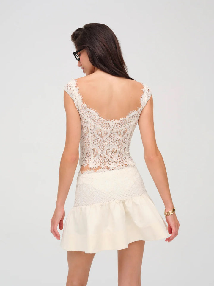 Top in pizzo avorio con bottoni frontali