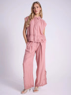 Blusa smanicato con ricamo floreale