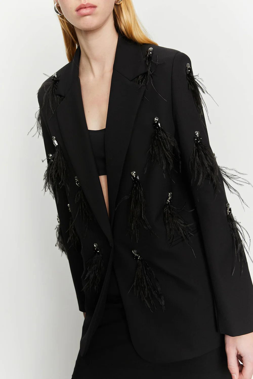Blazer con piume decorative