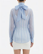 Blusa velata con collo alto