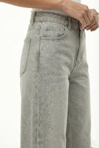 Jeans beige con strass laterali