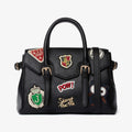 Borsa nera con patch ricamate e tracolla