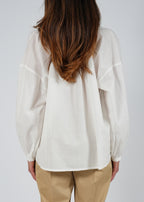 Blusa ascollo a V e maniche a sbuffo