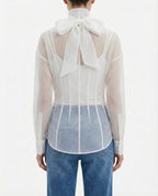 Blusa velata con collo alto