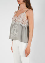 Top in seta con ricami in pizzo