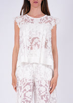 Top in pizzo ricamato con trasparenze floreali