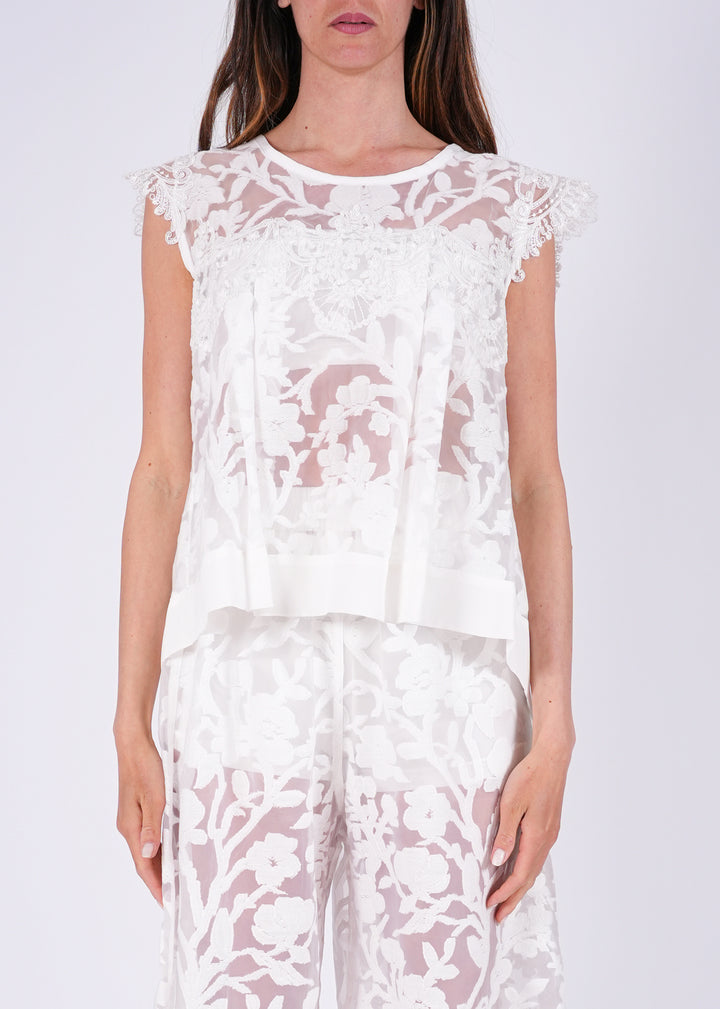 Top in pizzo ricamato con trasparenze floreali