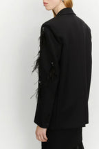 Blazer con piume decorative