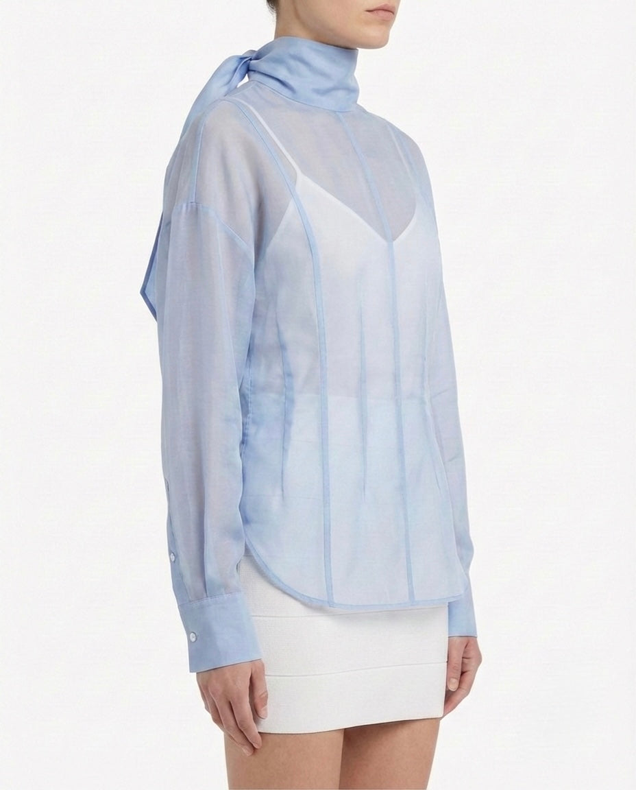 Blusa velata con collo alto
